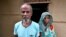 Abdul Suban, petani, dan istrinya berpose di luar rumah mereka di Desa Nellie, distrik Morigaon, di barat daya negara bagian Assam, India, 25 Juli 2018.