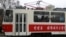 People ride on a tram with red stars stenciled across its side in Pyongyang, North Korea, Feb. 2, 2019. The red stars are awarded for every 50,000 kilometers (31,000 miles) driven without an accident.
