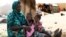 A Malian family displaced by war gather at a makeshift camp in Sevare, about 600 kilometers northeast of the capital Bamako, July 11, 2012.