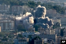 Smoke rises from Israeli airstrikes on Choueifat town, southern Beirut, Lebanon, Oct. 19, 2024.