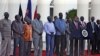 The seven detainees from South Sudan, shown here with Kenyan President Uhuru Kenyatta, after they were released to his custody, will be a third party at peace talks for South Suidan, along with pro- and anti-government negotiators. 