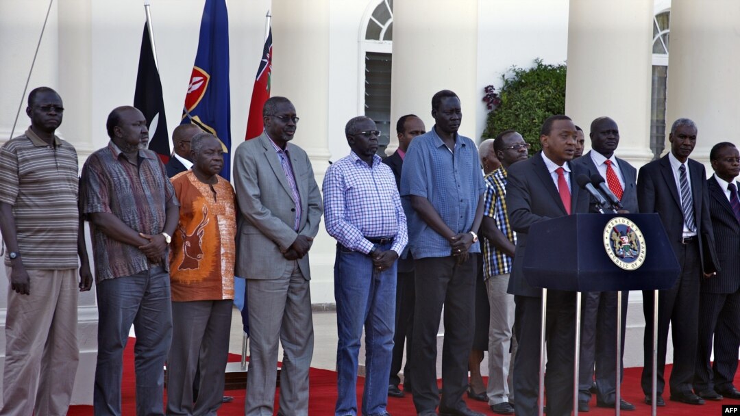 The seven detainees from South Sudan, shown here with Kenyan President Uhuru Kenyatta, after they were released to his custody, will be a third party at peace talks for South Suidan, along with pro- and anti-government negotiators. 