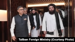 In this photo released by the Taliban Foreign Ministry, Indian Foreign Secretary Vikram Misri, left, and Taliban Foreign Minister Amir Khan Muttaqi, right, meet in Dubai, United Arab Emirates, on Jan 8, 2025, to hold wide-ranging bilateral talks.