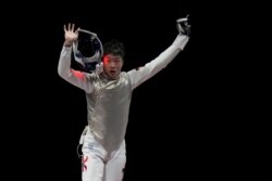 Ka Long Cheung of Hong Kong, celebrates defeating Daniele Garozzo of Italy in the men's individual final Foil competition at the 2020 Summer Olympics, July 26, 2021, in Chiba, Japan.