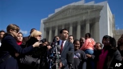 FILE - Debo Adegbile, special counsel, NAACP Legal Defense Fund, outside the Supreme Court, Washington, Feb. 27, 2013.