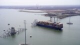 Aerial view of the Dali cargo vessel which crashed into the Francis Scott Key Bridge, causing it to collapse in Baltimore, Maryland, March 26, 2024.