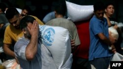 حمله هزاران نفر در غزه به انبار کمک‌های بشردوستانه