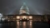 The U.S. Capitol in Washington is shrouded in mist.