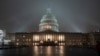 FILE - The U.S. Capitol in Washington is shrouded in mist.