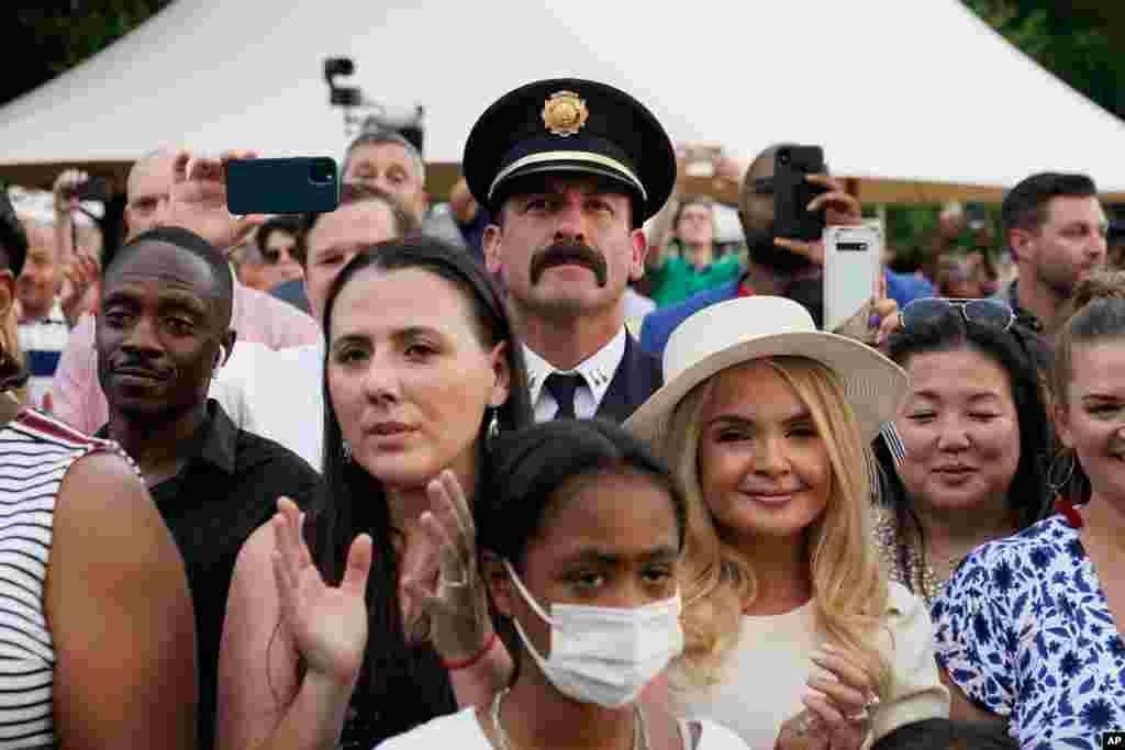 Attendees listen as President Joe Biden speaks during an Independence Day celebration on the South Lawn of the White House, July 4, 2021, in Washington. 