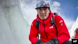 A team led by Jimmy Chin discovers a sock embroidered with "A.C. Irvine", along with a boot, on the Central Rongbuk Glacier below the North Face of Mount Everest, Oct. 11, 2024. (Jimmy Chin/National Geographic via AP)