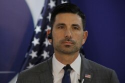 FILE - Acting Secretary of Homeland Security Chad Wolf listens during a press conference in Tegucigalpa, Honduras, Jan. 9, 2020.