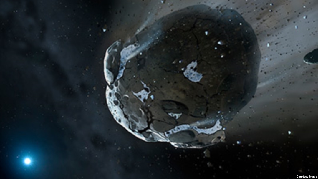 This is an artist's impression of a rocky and water-rich asteroid being torn apart by the strong gravity of the white dwarf star GD 61. (NASA, ESA, M.A. Garlick (space-art.co.uk), University of Warwick, and University of Cambridge)