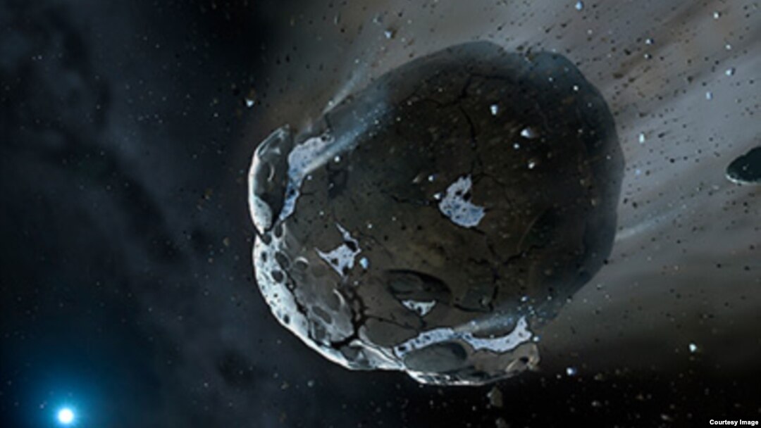 Ilustrasi asteroid berbatu yang kaya air dipecah gravitas kuat. 