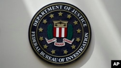 FILE - The FBI seal is pictured in Omaha, Neb., Aug. 10, 2022. The Biden administration said Tuesday that it detected and stopped a network attempting to smuggle people from Uzbekistan into the United States.