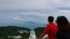 FILE - People look at the view from an observation point in Nangan Township, in the Matsu Islands, Taiwan, on October 15, 2024.