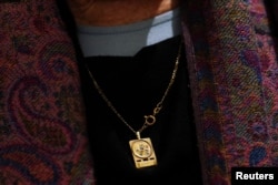 FILE - Holocaust survivor Sarah Jackson, 88, wears a pendant with Hebrew words which read "happiness", in Tel Aviv, Israel, January 17, 2024.