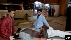 An injured victim of mosque bombing, is brought to hospital in Quetta, Pakistan, Jan. 10, 2020. 