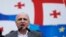 FILE - Vano Merabishvili, leader of opposition United National Movement party, addresses people during a rally in Tbilisi.