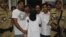 Indian police officers escort Mumbai attacks suspect Syed Zabiuddin, face covered, out from a government hospital in New Delhi, India on June 29, 2012.