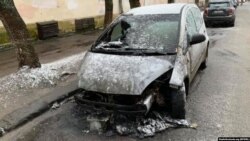 FILE - The burned-out car of RFE/RL journalist Halyna Tereshchuk in Lviv.