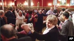 Members of "Yes We Can: Middle East Peace" dance together at a historic synagogue in downtown Washington DC