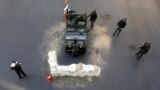 Thai soldiers take their positions in the middle of a main intersection in Bangkok&#39;s shopping district. Thailand&#39;s army declared martial law to restore order after six months of anti-government protests which have left the country without a proper functioning government, but the move did not constitute a coup, military officials said.
