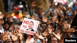 Supporters of the opposition Movement For Democratic Change (MDC) party take part in anti-government protests over economic hardships in Harare, Zimbabwe, Nov. 29, 2018.