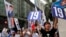 FILE - Supporters of Radical localist group Youngspiration's candidate Baggio Leung shout slogans near a polling station for the legislative council election, Sept. 4, 2016. 