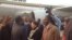 FILE: President Robert Mugabe with First Lady Grace Mugabe greeting some cabinet ministers and close relatives recently soon after his arrival from the United Nations General Assembly in New York. Partly obscured (left) is Vice President Joice Mujuru.