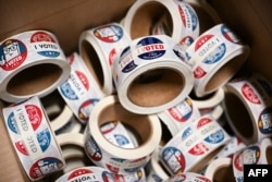 FILE - Rolls of “I Voted” stickers are stored at the Maricopa County Tabulation and Election Center ahead of the 2024 Arizona primary and general elections in Phoenix on June 3, 2024.