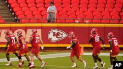 FILE - Kansas City Chiefs players run during NFL training camp at Arrowhead Stadium in Kansas City, Mo., Aug. 29, 2020.
