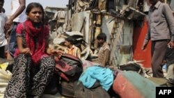 Рубина Али у развалин своего дома