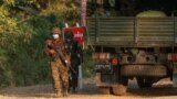 Myanmar's soldiers walk near the congress compound in Naypyitaw, Myanmar, Feb. 2, 2021. 