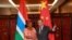 China's Foreign Minister Wang Yi (R) shakes hand with his Gambian counterpart Neneh Macdouall-Gaye during a meeting in Beijing, China, March 17, 2016.