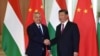 FILE - Hungarian Prime Minister Viktor Orban, left, shakes hands with Chinese President Xi Jinping during a meeting on April 25, 2019, as part of the second Belt and Road Forum in Beijing.