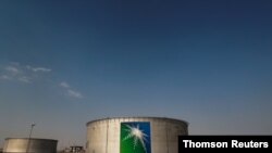 FILE PHOTO: Branded oil tanks at a Saudi Aramco oil facility in Abqaiq, located in the Eastern Province of Saudi Arabia.