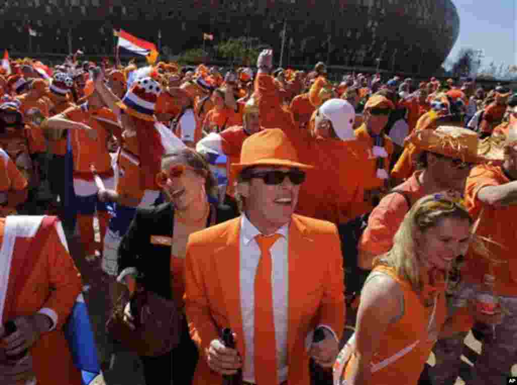 Dutch soccer fans gather prior to the World Cup group E soccer match between the Netherlands and Denmark at Soccer City in Johannesburg, South Africa, Monday, June 14, 2010. (AP Photo/Marcio Jose Sanchez)