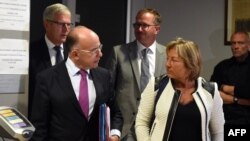 French Interior Minister Bernard Cazeneuve (L) speaks to Calais Mayor Natacha Bouchart after a meeting on the dismantle of the "Jungle" migrant camp on Sept. 2, 2016 in Calais, northern France.