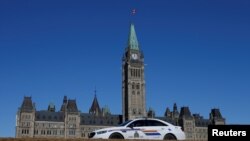 FILE - A Royal Canadian Mounted Police vehicle is seen on Parliament Hill in Ottawa, Ontario, March 22, 2017.