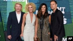 FILE - Phillip Sweet, from left, Kimberly Schlapman, Karen Fairchild and Jimi Westbrook, of Little Big Town, arrive at the CMT Music Awards at Bridgestone Arena in Nashville, Tennessee, June 10, 2015.