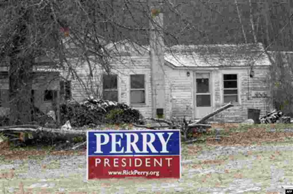 As sign for Republican presidential candidate, Texas Gov. Rick Perry is seen in front of a home in Barnstead, N.H. , Friday, Jan. 6, 2012 .New Hampshire voters go to the polls next Tuesday to voter in the first-in-the-nation presidential primary. (AP Phot