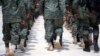 Members of Haiti's new national military force march during training at a former U.N. base in Gressier, Haiti, April 11, 2017. While it's easy to find citizens who strongly support reconstituting a Haitian army, the idea alarms those who vividly remember military coups and oppression. 