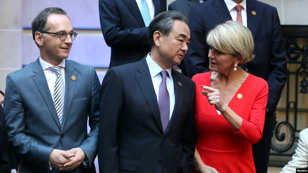 FILE - Australia's FM Julie Bishop talks to her Chinese counterpart, Wang Yi, as Germany's FM Heiko Maas watches, at the G20 Meeting of Foreign Affairs Ministers in Buenos Aires, Argentina, May 21, 2018. 