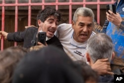 Angry Spanish flood survivors confront King Felipe VI in the devastated town of Paiporta, near the city of Valencia, Nov. 3, 2024.