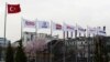 Flags of the Dogan Media Group are seen outside the Dogan Media Center in Ankara, Turkey, March 22, 2018.