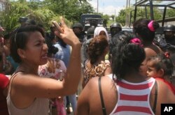 Relatives and friends of inmates gather outside the state prison in Acapulco, Mexico, July 6, 2017. Fighting erupted between rival gangs inside the prison and more than 25 inmates were killed.