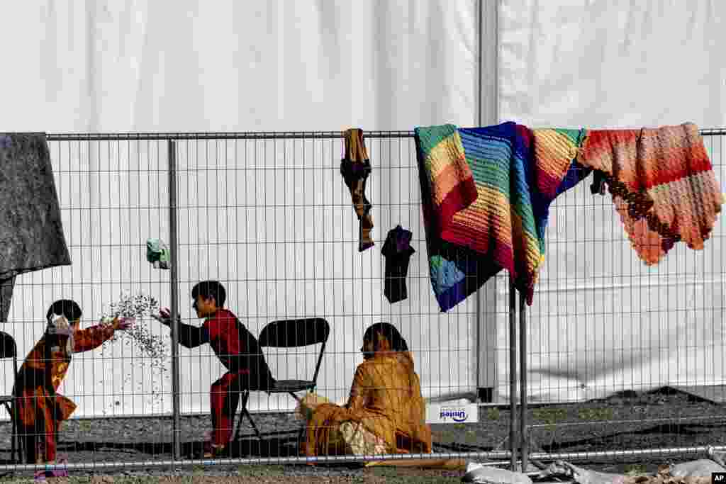 Children play with rocks at an Afghan refugees camp on Joint Base McGuire Dix Lakehurst, New Jersey.