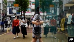 香港街頭戴著口罩的香港民眾（2020年3月13日）