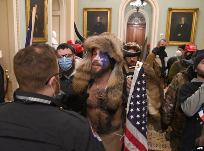 Supporters of US President Donald Trump enter the US Capitol on January 6, 2021, in Washington, DC.